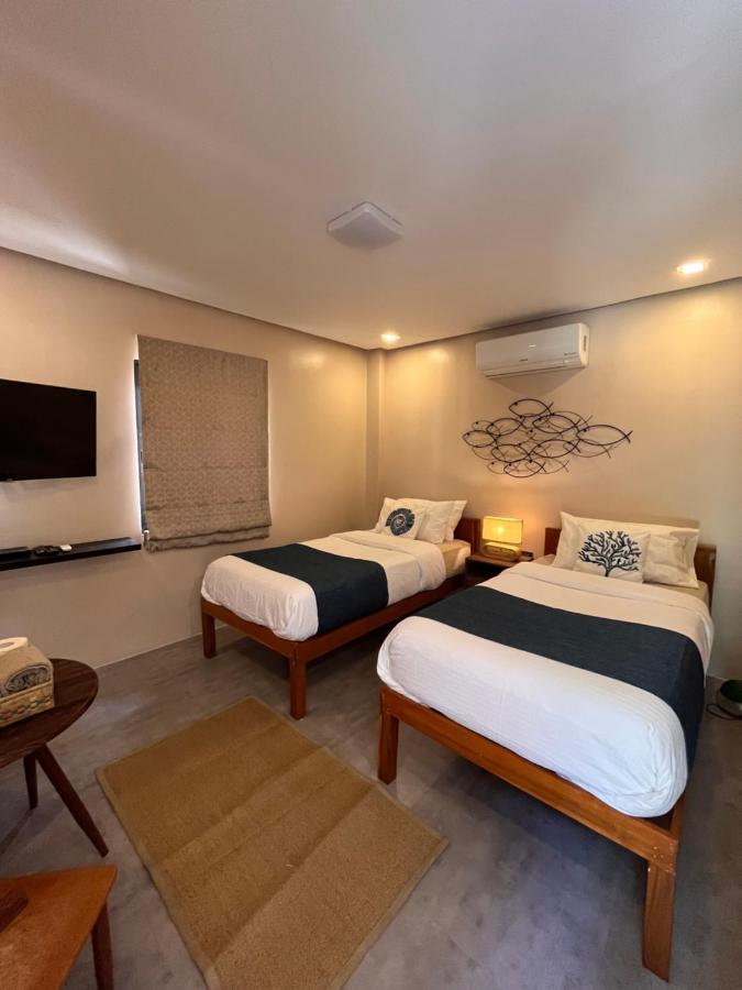 Southseas Beach Resort And Dive Center Santander Buitenkant foto