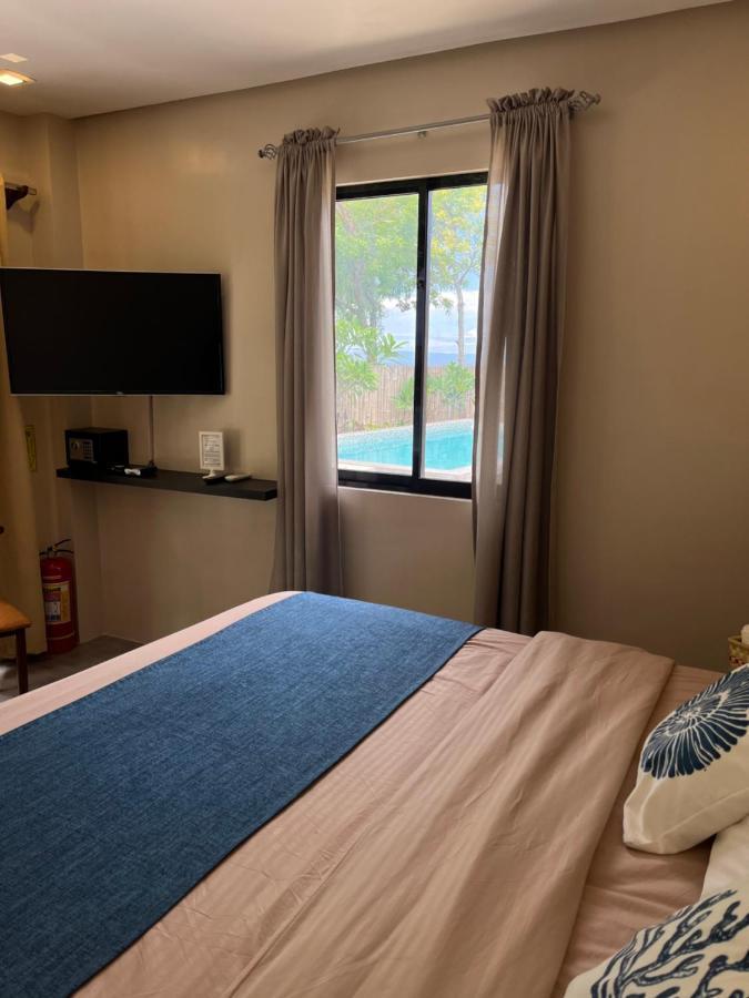 Southseas Beach Resort And Dive Center Santander Buitenkant foto