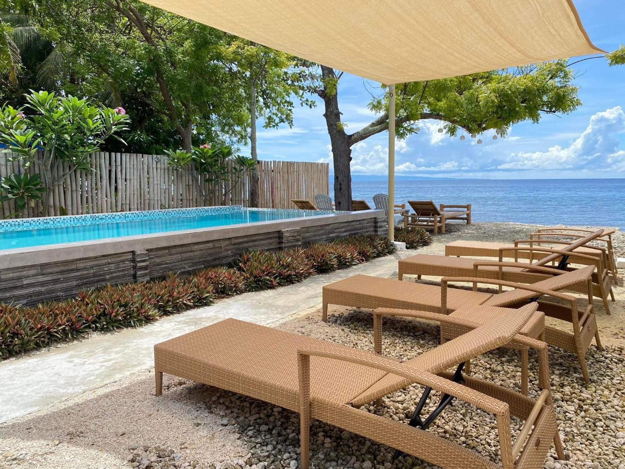 Southseas Beach Resort And Dive Center Santander Buitenkant foto